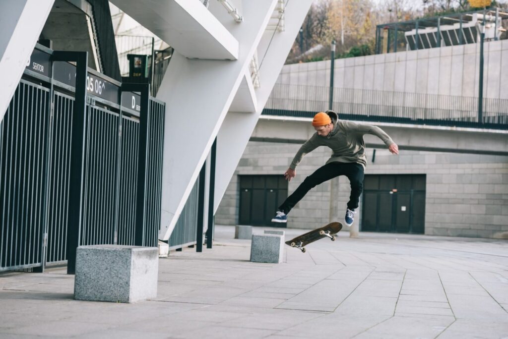 skateboarder-performing-jump-trick-in-urban-location-e1633601107869.jpg